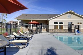 Lacey apartment for rent - Pool with lounge chairs and apt buildings Lacey WA Apartments For Rent l Copper Wood 