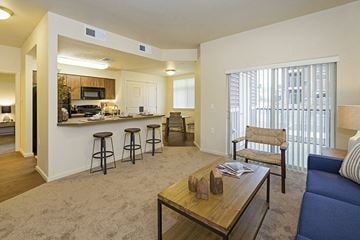 Puyallup apartment for rent - A living room with a blue couch and a coffee table.