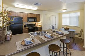 Colorado Springs apartment for rent - Full kitchen with dining area view Copper Range Apartments | Colorado Springs, Colorado