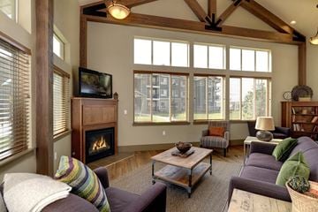 Colorado Springs apartment for rent - a living room with a couch and a television and a fireplace