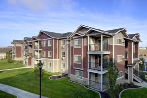 Colorado Springs apartment for rent - Pathway with grass to apt buildings Colorado Springs, CO 80908 | Copper Range Apartments