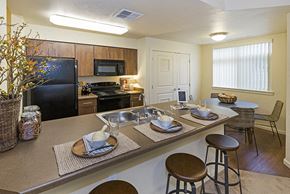 Spokane apartment for rent - Full kitchen with dining area view Copper River Apartments For Rent l Spokane Washington 99224