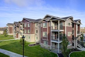 Spokane apartment for rent - Pathway with grass to apt buildings Spokane WA 99224 l Copper River Apartments For Rent