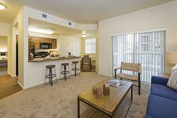Lancaster apartment for rent - A living room with a blue couch and a coffee table.