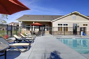 Lancaster apartment for rent - Pool with lounge chairs and apt buildings Copper Square Apartment Rentals in Lancaster Ca 