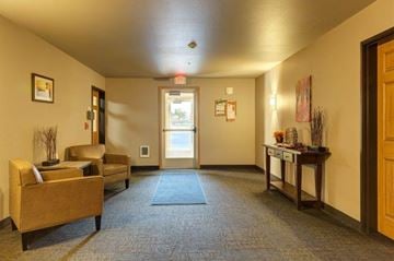 Sidney apartment for rent - a living room with a couch and a door