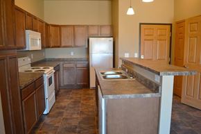 Stanley apartment for rent - a kitchen with a stove and a refrigerator