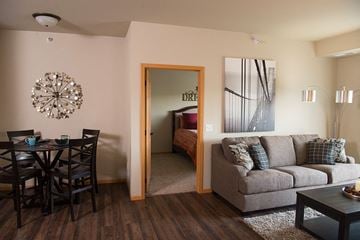 Rapid City apartment for rent - a living room with a couch and a dining room table