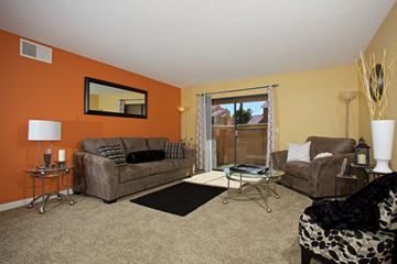 Las Vegas apartment for rent - a living room with two couches and a table
