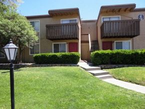 El Paso apartment for rent - Apt building behind grass area EL Paso TX 79935 Apts l Lake Fairway