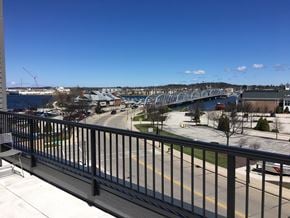 Sturgeon Bay apartment for rent - a balcony with a view of a river and a bridge