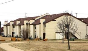 Tulsa apartment for rent - a group of houses with cows in front of them
