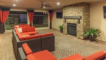 Peoria apartment for rent - a living room with a fireplace and orange furniture