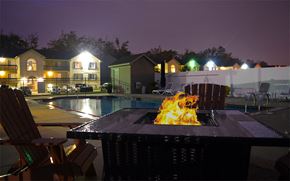 Swansea townhouse for rent - Night time image of fire pit located next to the pool