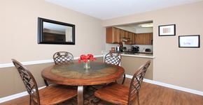 Winston-Salem apartment for rent - A dining room with a wooden table and chairs.