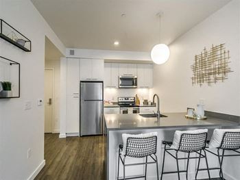 Fridge, stainless steel sink in kitchen