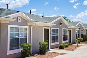 El Paso townhouse for rent - a beige house with a sidewalk in front of it