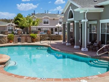 El Paso townhouse for rent - a resort style swimming pool with a house in the background