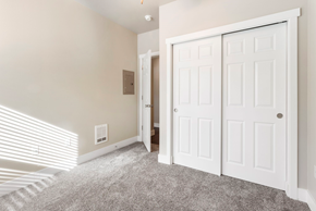 Tumwater apartment for rent - a bedroom with two closets and a carpeted floor