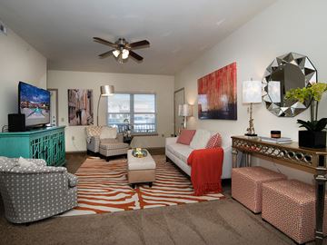 Manhattan apartment for rent - a living room filled with furniture and a ceiling fan