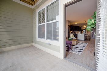 Wide doors leading outside private balcony/patio