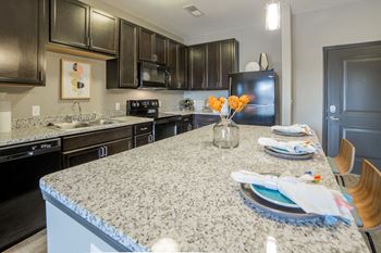 Sleek counter tops in kitchen
