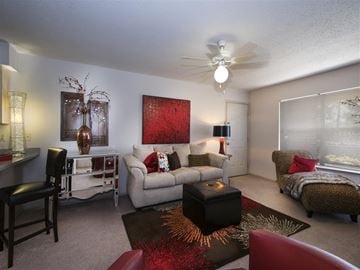 Sherwood apartment for rent - a living room with a couch and a ceiling fan