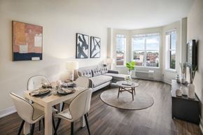 Jersey City apartment for rent - A modern dining room with a white table and chairs.