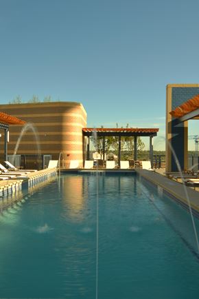 Washington apartment for rent - A swimming pool with a clear blue water and a building in the background.