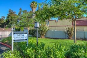 La Habra apartment for rent - a sign in the grass in front of a building