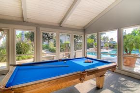 La Habra apartment for rent - a pool table in a screened in porch with a swimming pool