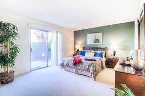 La Habra apartment for rent - a bedroom with a bed and a sliding glass door