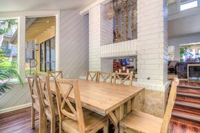 Anaheim apartment for rent - a dining room with a wooden table and chairs