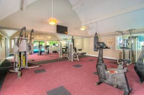 Fullerton apartment for rent - a gym with a lot of exercise equipment in it