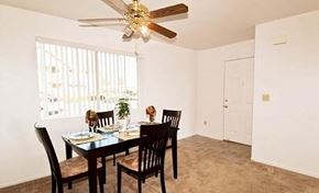 Redding apartment for rent - a dining room with a table and a ceiling fan