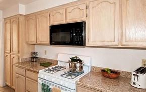 Redding apartment for rent - a kitchen with a stove and a microwave