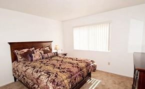 Redding apartment for rent - a bedroom with a bed and a window