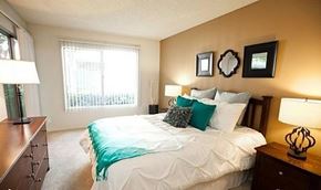 Buena Park apartment for rent - a bedroom with a large bed and a window