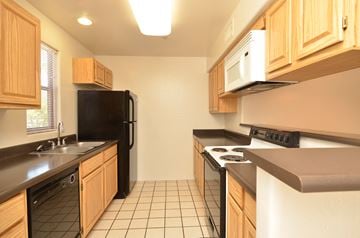 Scottsdale apartment for rent - a kitchen with a stove refrigerator and sink