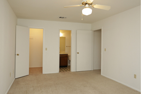 Cleveland apartment for rent - an empty living room with a ceiling fan and a closet