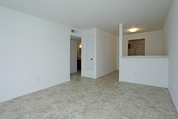 Houston apartment for rent - an empty living room with white walls and a tile floor