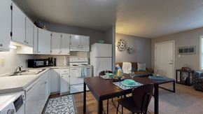 Greenville apartment for rent - an open kitchen and living room with a dining room table