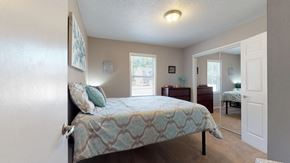 Greenville apartment for rent - a bedroom with a bed and a closet