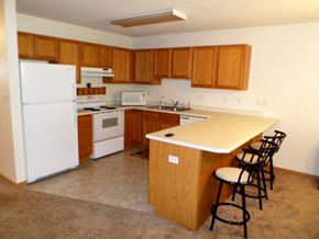 Pine Island townhouse for rent - a kitchen with a counter top and a refrigerator