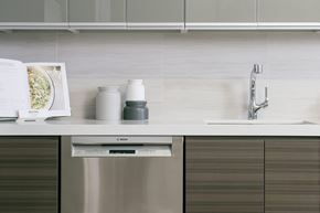 New York apartment for rent - a kitchen with a sink and a book on the counter