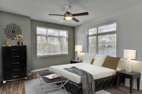 Fort Collins apartment for rent - Village on Redwood bedroom with large windows and ceiling fan