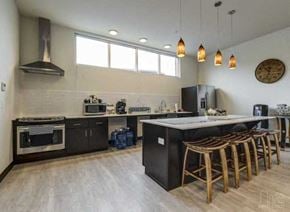 Arlington apartment for rent - a large kitchen with a counter and chairs