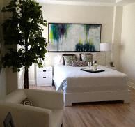Los Angeles apartment for rent - a bedroom with a bed and a tree