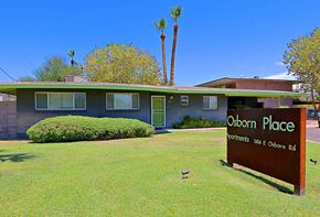 Phoenix apartment for rent - a sign in front of a house with palm trees