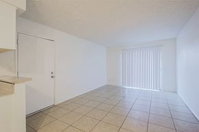 Phoenix apartment for rent - the living room and dining room of an apartment with a tiled floor